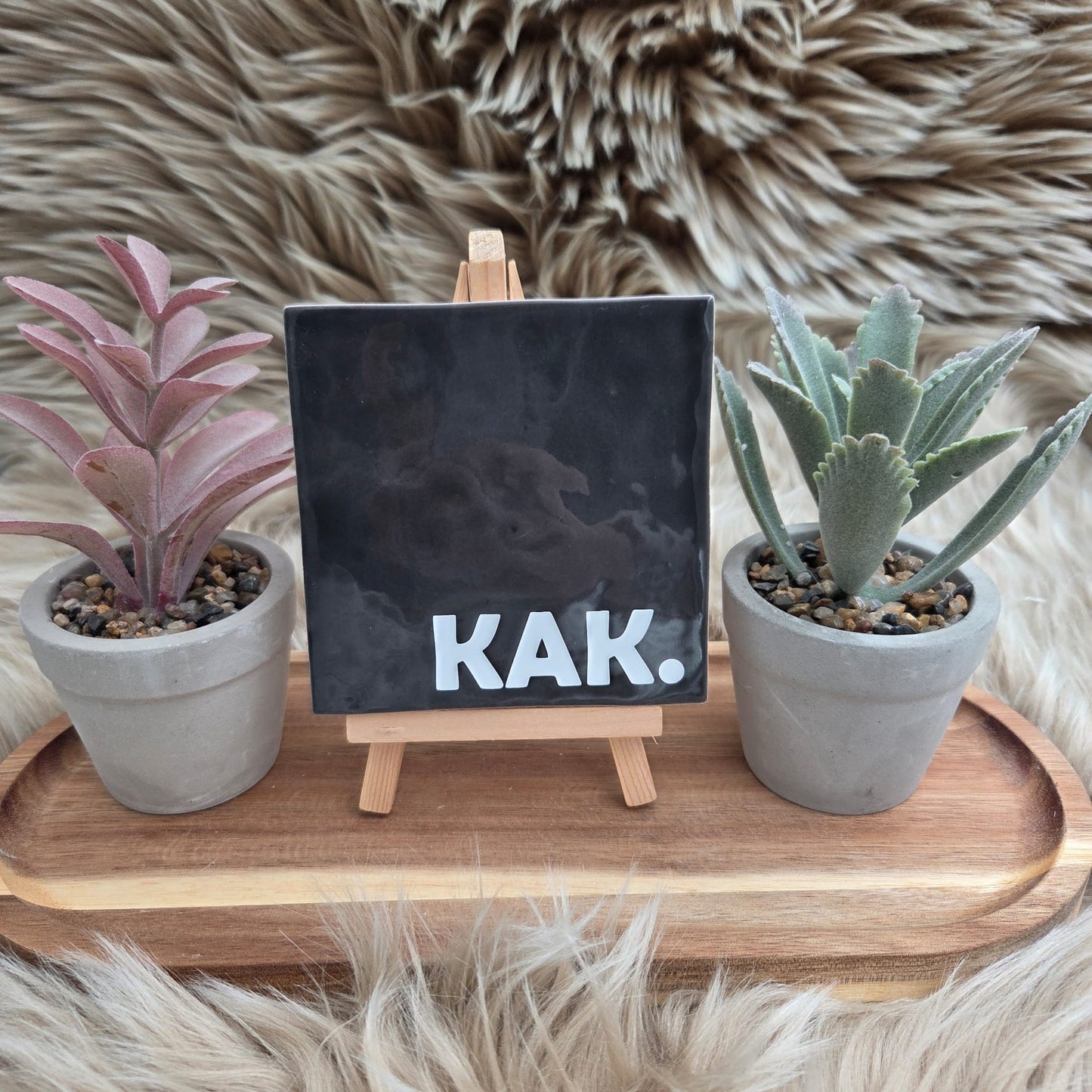 Robuust wenstegeltje: KAK.