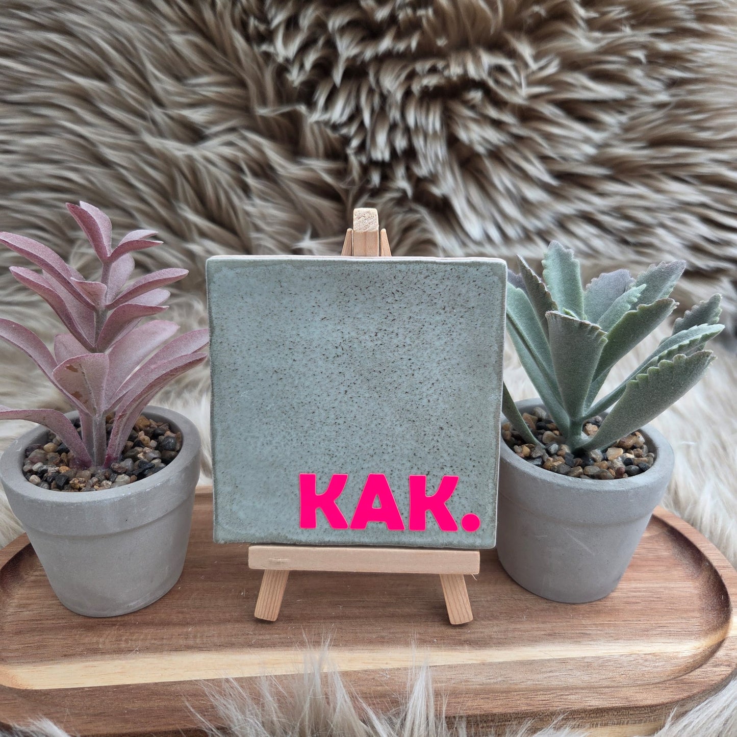 Robuust wenstegeltje: KAK.