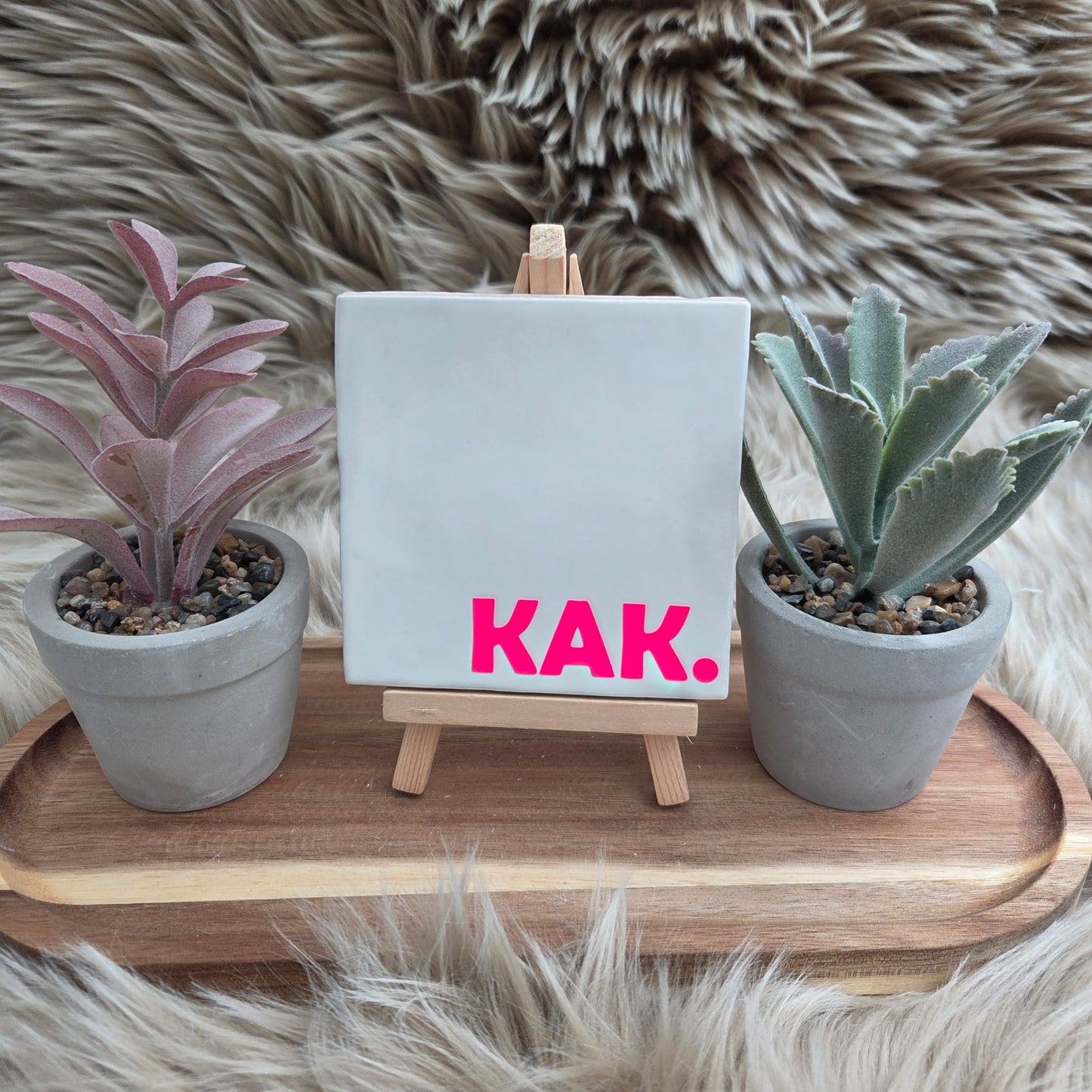 Robuust wenstegeltje: KAK.