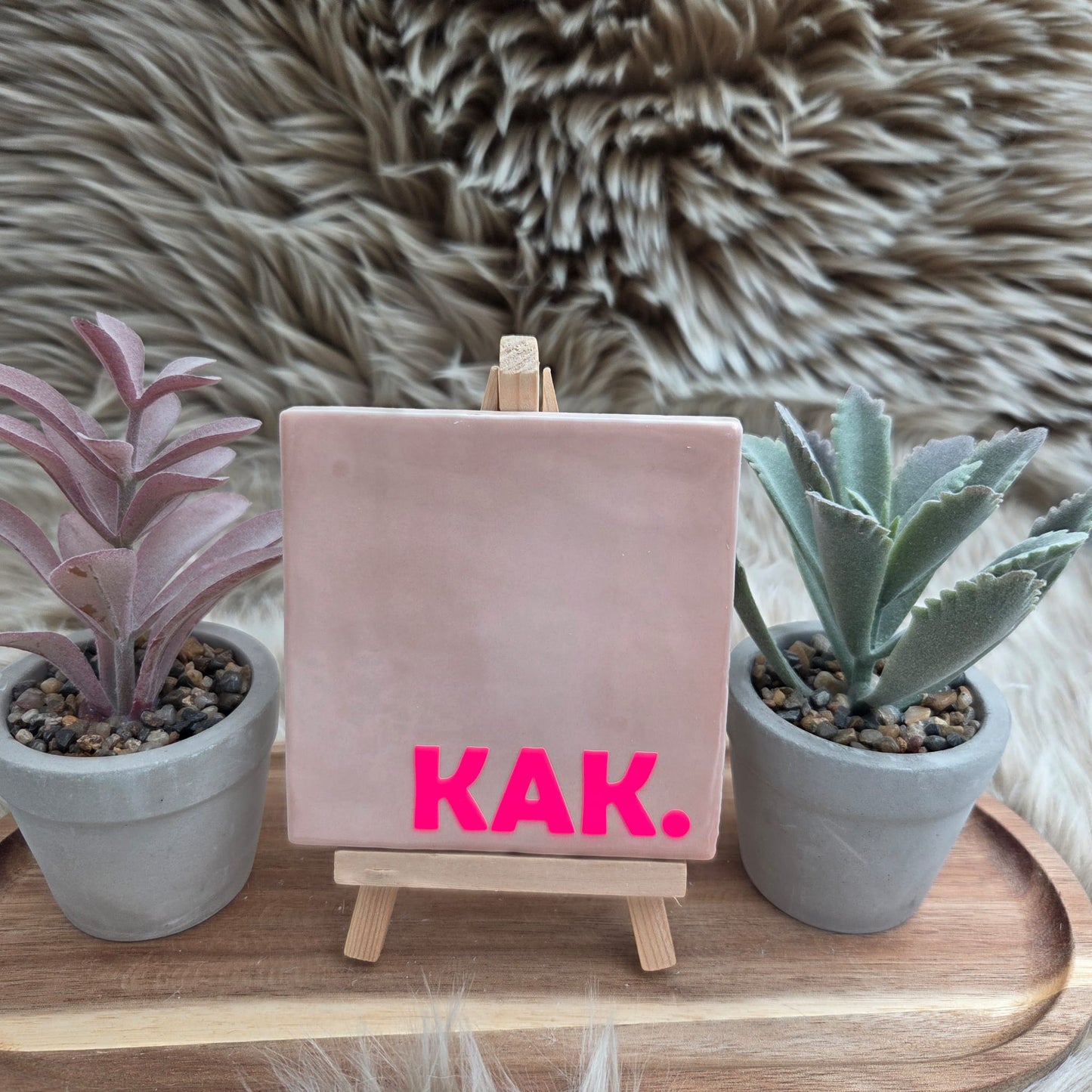 Robuust wenstegeltje: KAK.